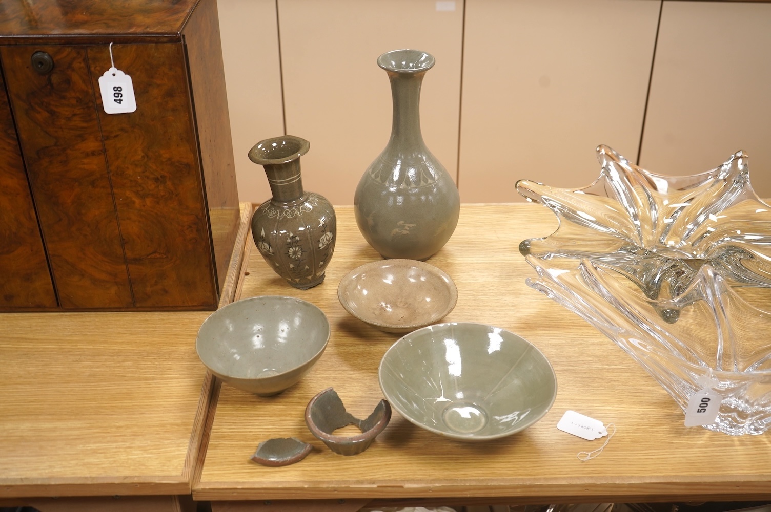 Five pieces of Chinese/Korean celadon comprising three bowls and two vases, 31cm high. Condition - some breaks